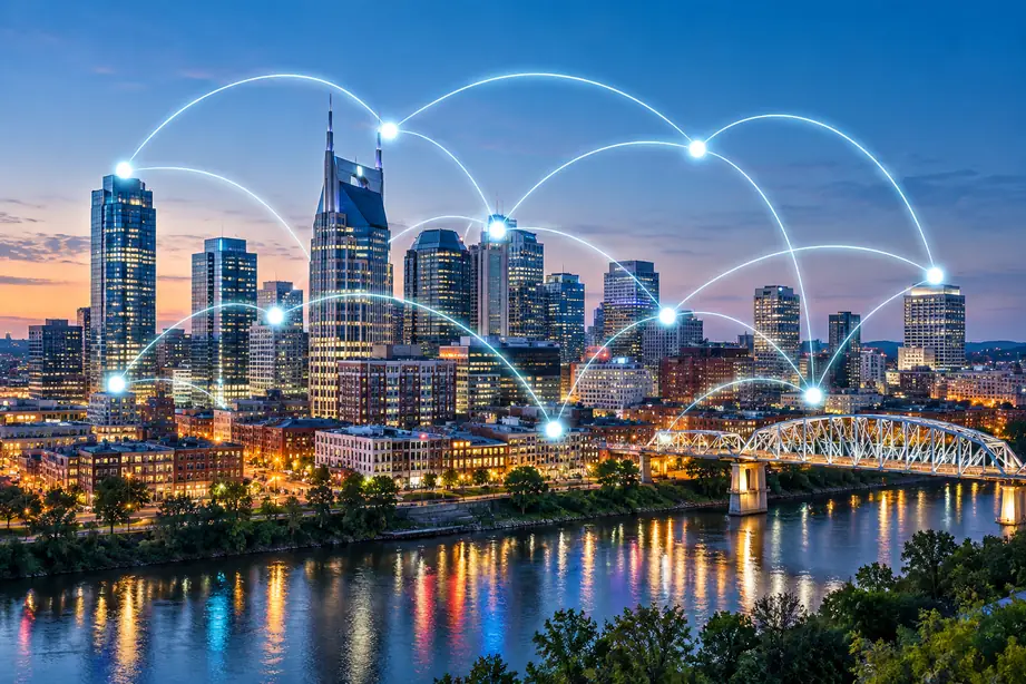 Cloud Services Nashville 2 Nashville, TN skyline at dusk with cloud network connections over the Cumberland River